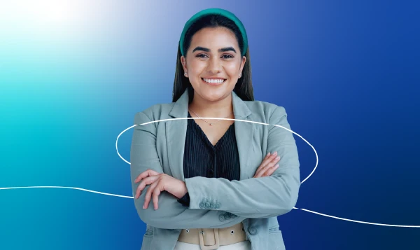 A lady holding a laptop with a gradient blue background.