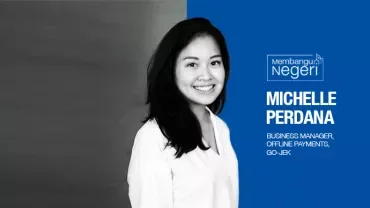 Person smiling with a blue and gray background, text reads: 'Michelle Perdana, Business Manager, Offline Payments, GO-JEK'.