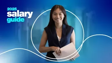 salary guide 2025 - A Woman holding a paper