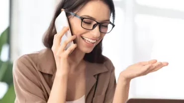 A woman talking on the phone | When to use a recruitment agency