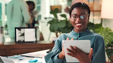A professional employer smiling when seeing the results of vertical and horizontal career growth strategy implementation.