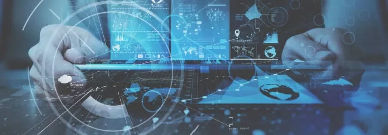 Person using laptop with digital interface overlay displaying graphs and network icons.