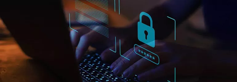 Hands typing on a laptop keyboard with a digital security padlock icon.