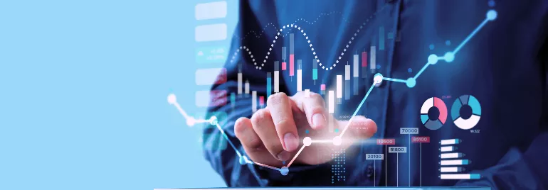 Person interacting with digital financial graphs on a screen.