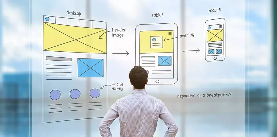 Person observing web design sketches on glass screen.