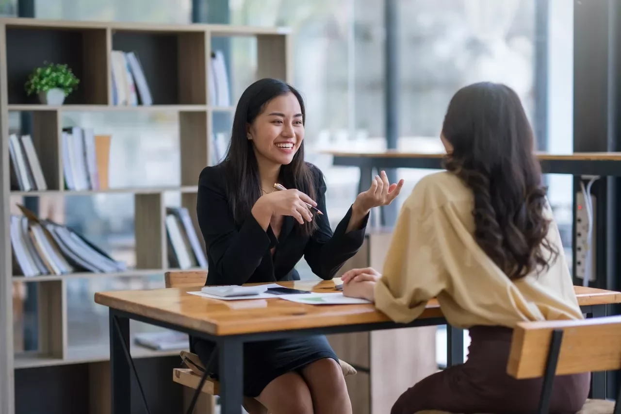 Two executives speaking with each other